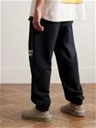 RRR123 - Tapered Logo-Print Cotton-Jersey Sweatpants - Black