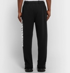 Vetements - Logo-Print Fleece-Back Cotton-Jersey Sweatpants - Men - Black