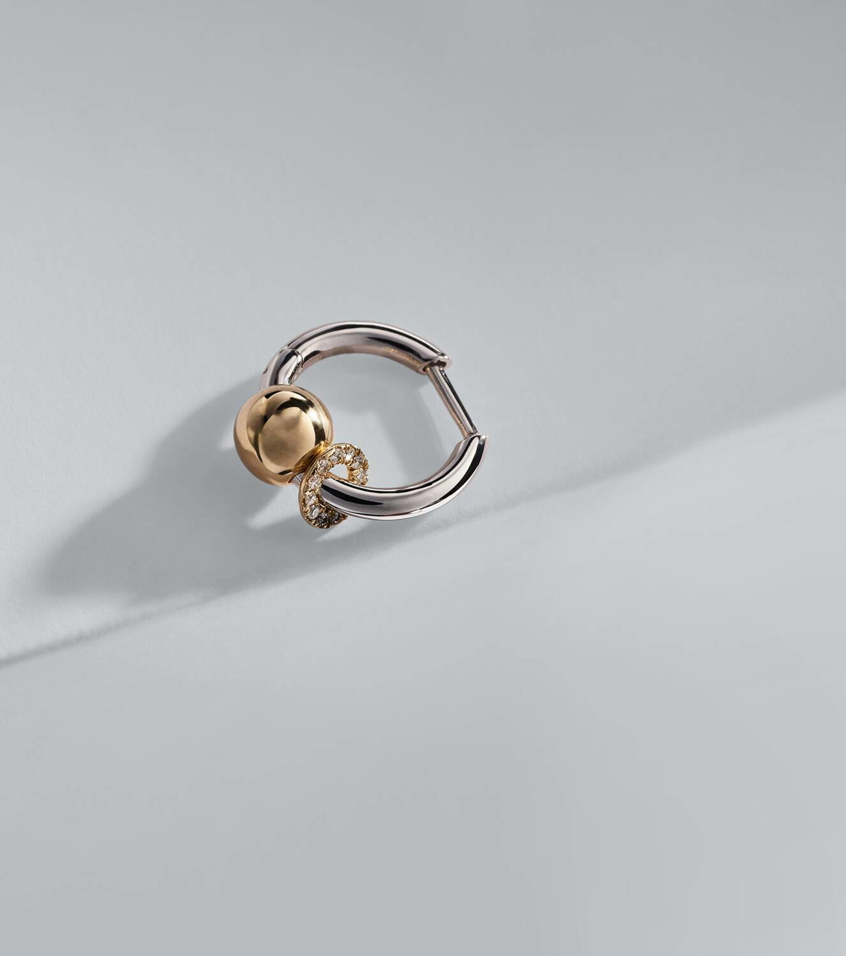 Rainbow K Piercing 14kt gold single earring with diamonds