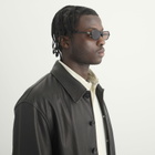 Miu Miu Eyewear B10SU Sunglasses in Black/Brown 