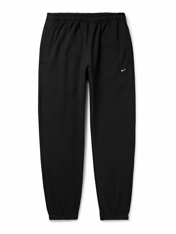 Photo: Nike - Solo Swoosh Tapered Logo-Embroidered Cotton-Blend Jersey Sweatpants - Black