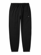 Nike - Solo Swoosh Tapered Logo-Embroidered Cotton-Blend Jersey Sweatpants - Black