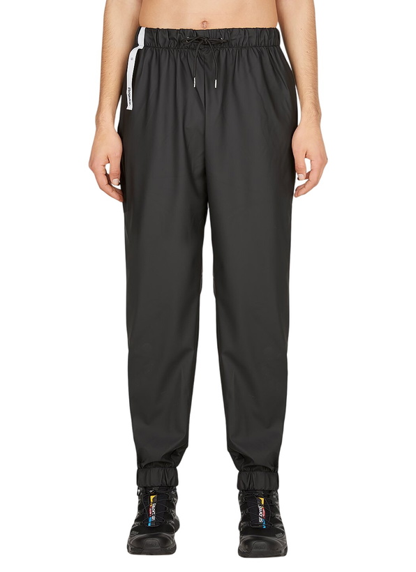 Photo: Rains Coated Track Pants