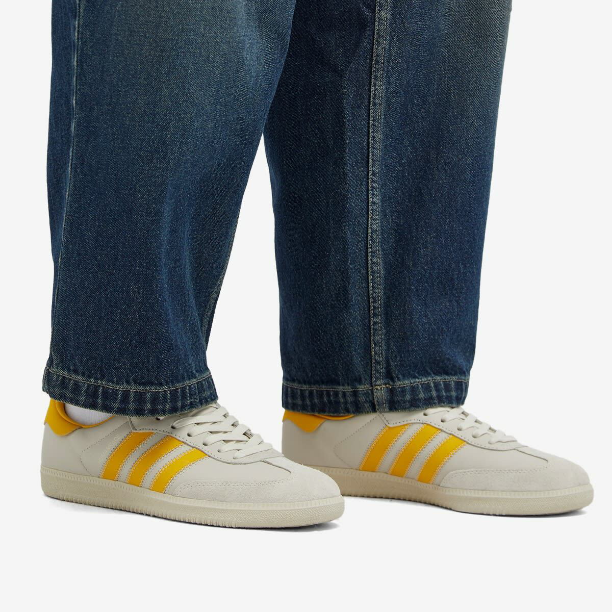 gold human race shoes