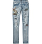 AMIRI - Skinny-Fit Distressed Appliquéd Panelled Stretch-Denim Jeans - Blue