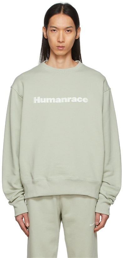Photo: adidas x Humanrace by Pharrell Williams SSENSE Exclusive Green Humanrace Tonal Logo Sweatshirt