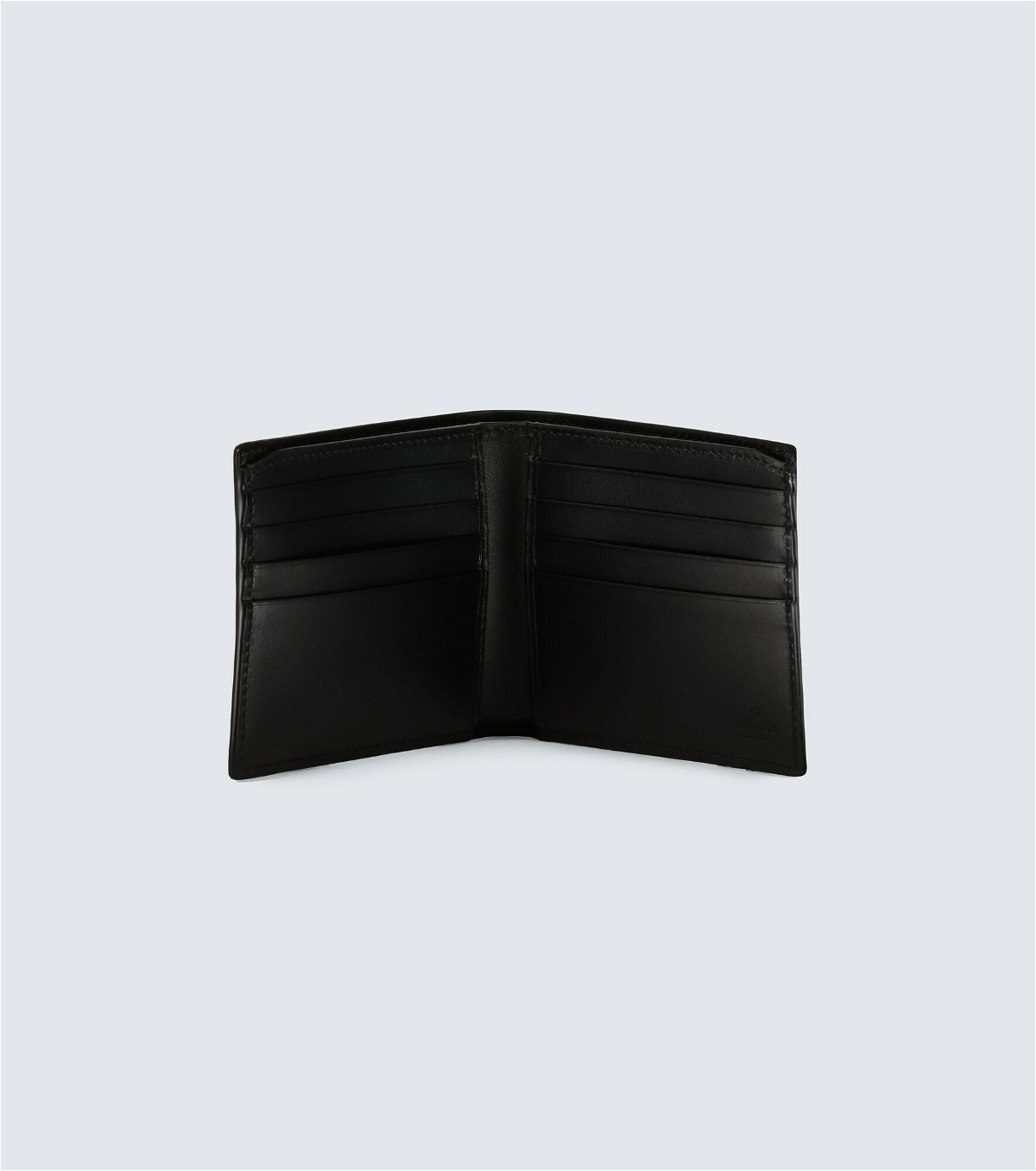 GUCCI Black vertical wallet in Jumbo GG