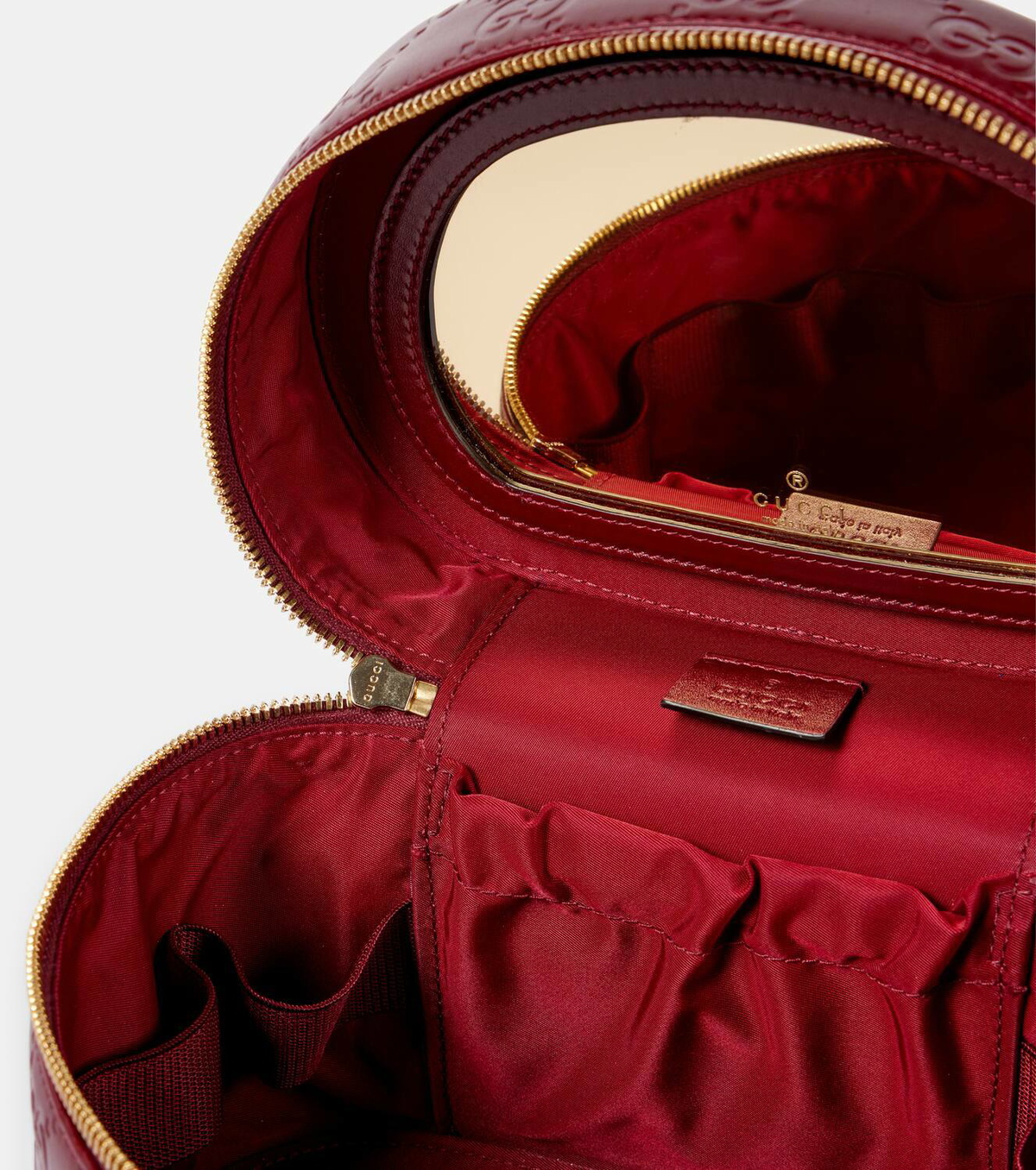 Gucci GG embossed leather vanity bag