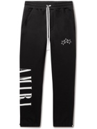 AMIRI - Slim-Fit Tapered Logo-Print Cotton-Jersey Sweatpants - Black