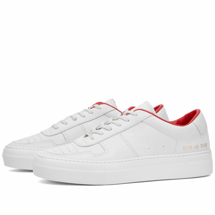 Photo: Woman by Common Projects Women's Basketball Summer Low Nubuck Sneakers in White/Red